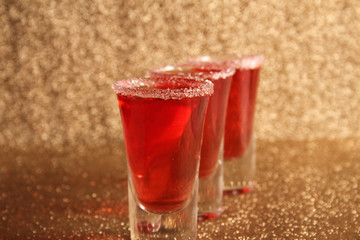 Three glasses with alcoholic drinks