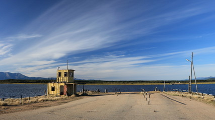 Fototapeta na wymiar Old small unused ferry port at the shore of lake Baikal in Siberia, Russia
