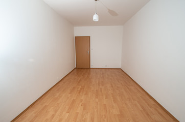 empty room with wooden floor and wall