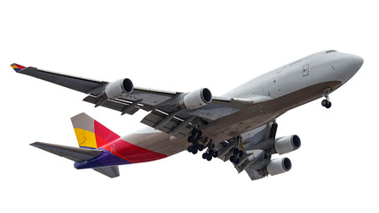 Flying big modern passenger aircraft with landing gear isolated on a white background