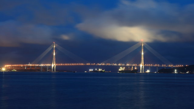 Tall bridge with pillon in clouds