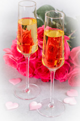 Two Glasses of Champagne and Pink Roses