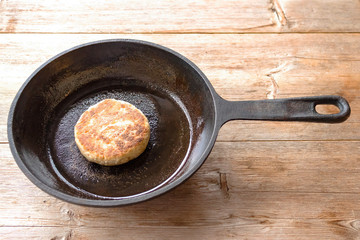 Russian syrniki baked fried cottage cheese pancakes curd fritters breakfast in cast iron skillet
