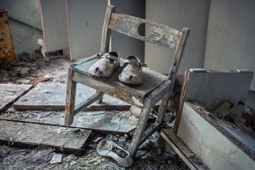 Child boots in the abandoned kindergarten in the ghost town of Pripyat, Ukraine