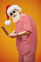 Fototapeta na wymiar elderly Christmas hacker