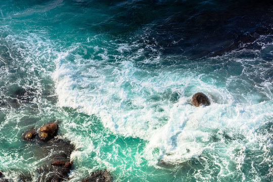 crushing sea waves texture. turquoise water background. dynamic water view from above 