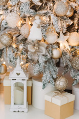 Christmas gifts under fir tree. Vintage New Year decorations. gift boxes and lantern under fir tree. Christmas mood. Celebrating of New Year