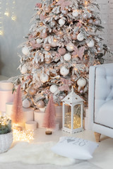 Christmas gifts under fir tree. Vintage New Year decorations. gift boxes and lantern under fir tree. Christmas mood. Celebrating of New Year