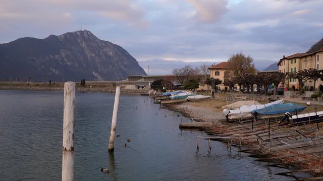 Lugano Lake. Walk Through on Pier in Bissone, tiny village on the lake. Cold