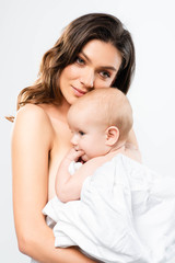 portrait of naked mother hugging baby boy, isolated on white