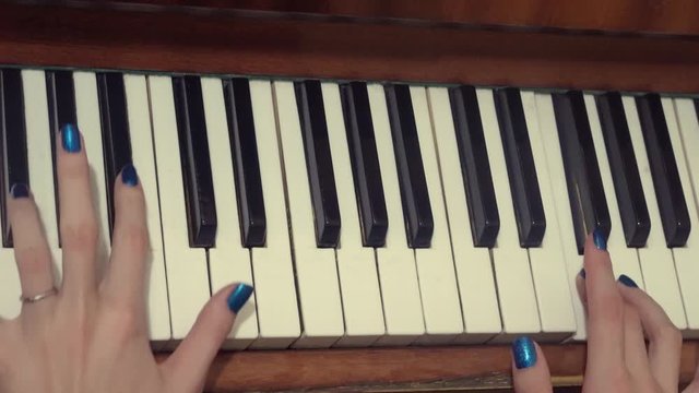 woman plays the old piano, top view and side view, close up, fingers press the keys.