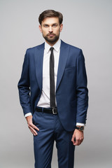 Fototapeta premium studio photo of young handsome businessman wearing suit