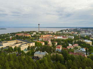 Naklejka premium Tampere, Finland. City views from shore of Tammerkoski river in midde of Tampere. Näsinneula tower.