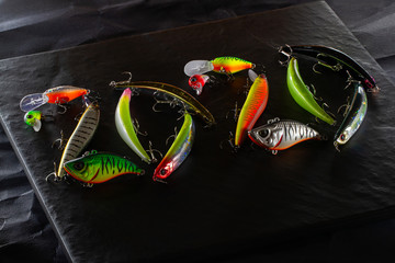 New Year 2020. Plastic fishing lures in the form of the number 2020.  Plastic fishing lures BENT 20MINNOW 106 from OSP, ONETEN LBO from MEGABASS, ? CHUBBY and CHUBBY VIBRATION from JACKALL