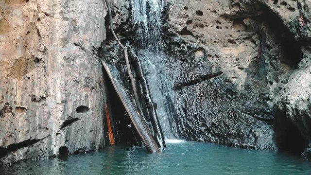 Pam Bok Gorge Waterfall Hidden in Thailand Jungle. Rocky Cliff, Clear Water Running to Peaceful Pond Zoom in. Picturesque Chiang Mai Unspoiled Nature Slow Motion. Footage Shot in 4K
