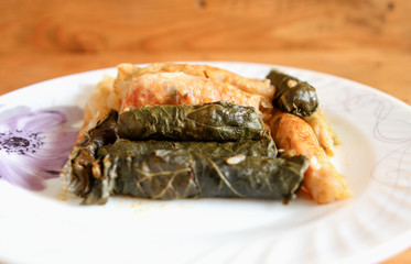 Stuffed vine and cabbage leaves with rice, Sarma, Dolmades, Dolmadakia, on an old table