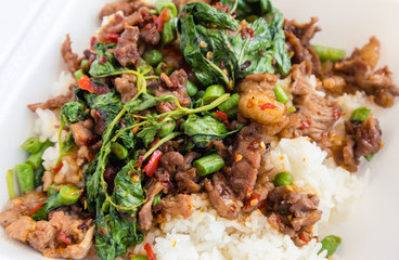 Fried rice with beef basil in foam box