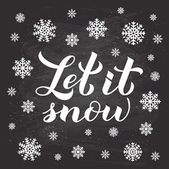 Let is snow calligraphy hand lettering on chalkboard background with snowflakes. Christmas, New Year and winter holidays typography poster. Vector template for greeting card, banner, flyer, postcard.