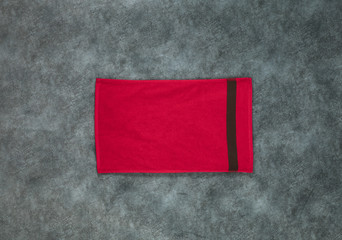 red towel on a green cloth background