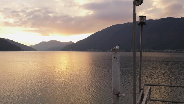 Lugano Lake. Walk Through on Pier in Bissone, tiny village on the lake. Cold