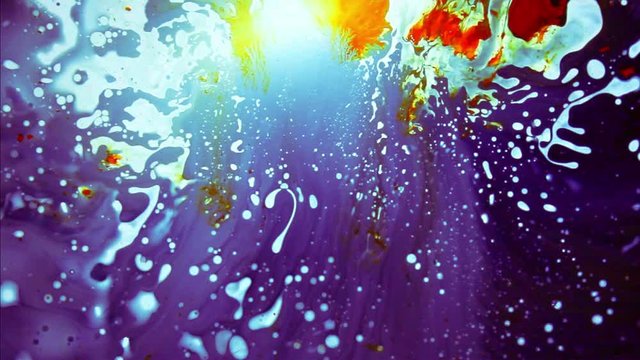 Psychedelic abstract liquid light show, weird ink patterns in water, oil, paint. Multicolor 60's disco oil wheel. Organic swirl pattern, dye explosion, kaleidoscope of colors. Bright trippy wallpaper