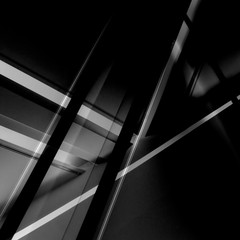 Digitally rendered image of modern architecture or interior with luminescent lamps. Glowing lines in darkness. Abstract black geometric background with luminous polygonal structure in grunge style.