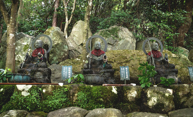 Purification fountain in the garden along forest of Daishoin shrine, Miyajima, Japan