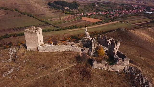 Aerial shot of Coltesti medieval fortress, on a sunny autumn day