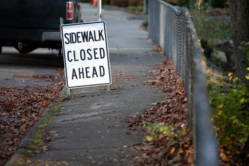 "Sidewalk Closed Ahead" sign of a roadside