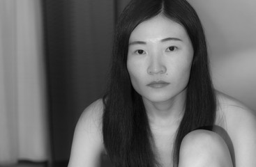 Chinese woman looking solemn