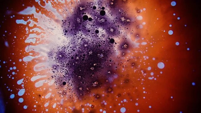 Psychedelic abstract liquid light show, weird ink patterns in water, oil, paint. Multicolor 60's disco oil wheel. Organic swirl pattern, dye explosion, kaleidoscope of colors. Bright trippy wallpaper