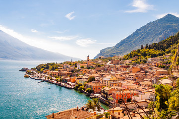 Limone Sul Garda cityscape on the shore of Garda lake surrounded by scenic Northern Italian nature. Amazing Italian cities of Lombardy