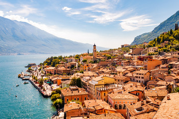 Limone Sul Garda cityscape on the shore of Garda lake surrounded by scenic Northern Italian nature. Amazing Italian cities of Lombardy