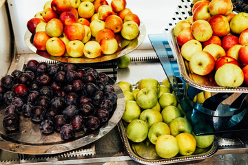 fresh fruit plates on the table lay a restaurant kitchen