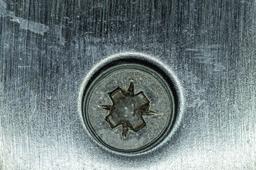 Metal chrome-plated strap door lock with a screw close-up