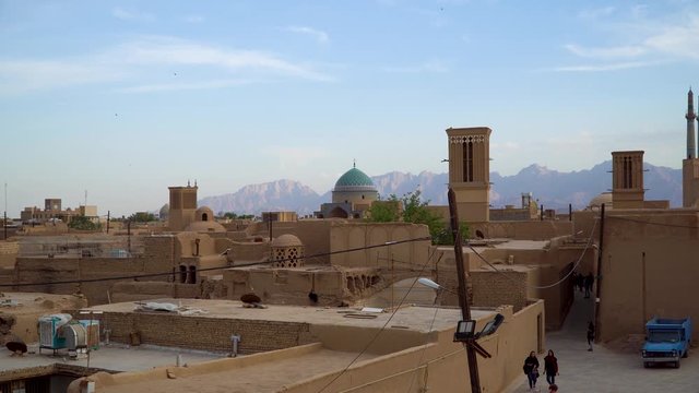 Yazd, Iran - May 2019: Yazd cityscape with old brick buildings and badgirs wind catching towers in Yazd, Iran.