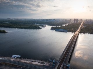 Naklejka premium Aerial view to Metro Bridge through the Dnipro river with view to cityscape of Kiev, Ukraine