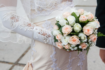 Beautiful wedding bouquet in hands of the bride