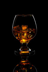 glass of scotch whiskey with ice