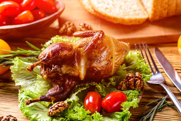 Cooked quail served on plate with parsley