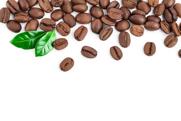 Heap of roasted coffee beans with leaves isolated on white background with copy space for your text. Top view. Flat lay.