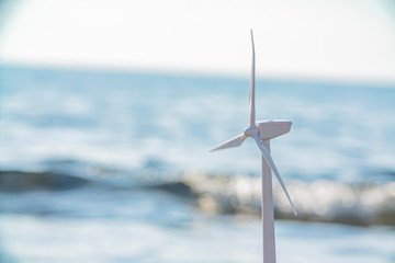 Wind turbine farm power generator in beautiful sea landscape for   production of renewable green...