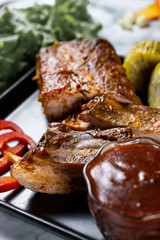 grilled steak with sauce and vegetables