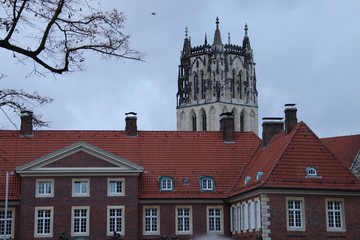 old church spire with old city surroundings