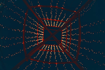 Red glitter vintage lights background. defocused.