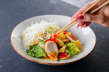 Vietnamese rice noodle with vegetables salad in white bowl