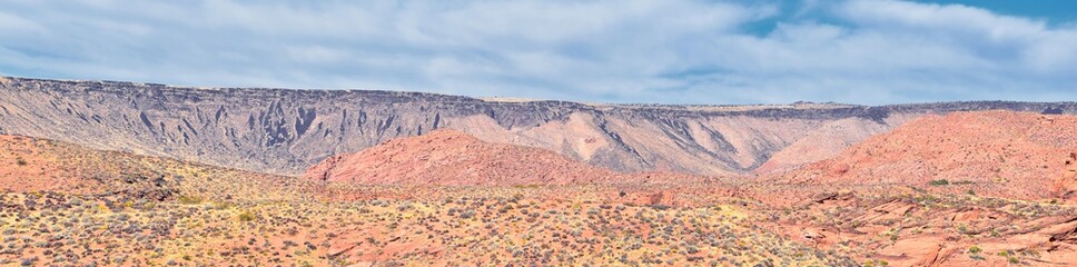 Fototapeta premium Red Cliffs National Conservation Area Wilderness and Snow Canyon State Park from the Elephant Arch and bone wash Trail by St George, Utah in desert reserve. United States. USA.
