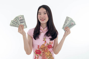 Chinese new year with Beauty smiling woman wears dresses traditional cheongsam and holds money, studio shot isolated on white background.