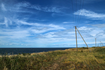 The Picture from the wild coast of Paldiski in Estonia. You can see the electricity poles on the cliffs.   