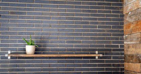 wood shelf on grey brick wall background